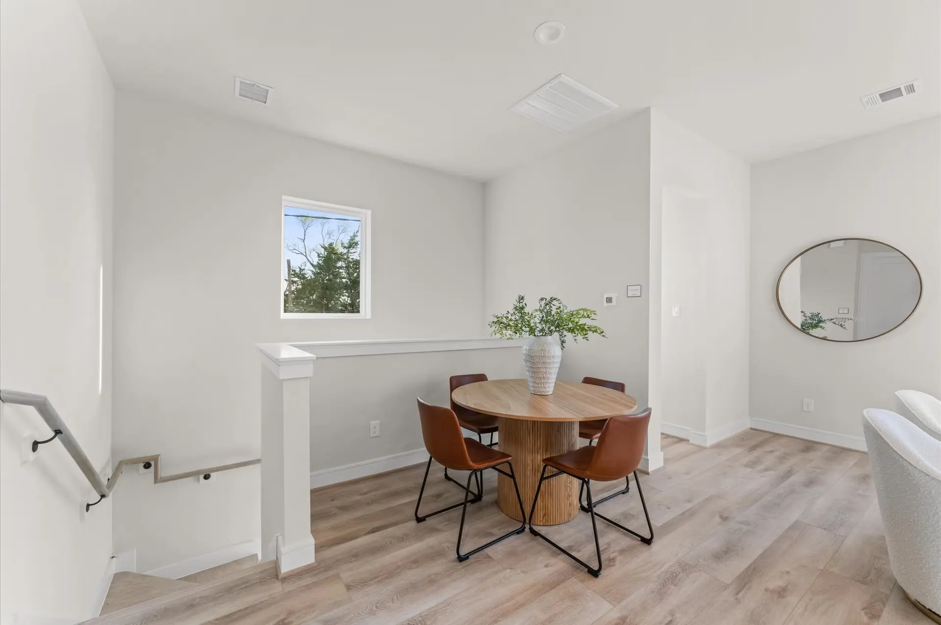Highland Gardens townhome dining area with pendant lighting